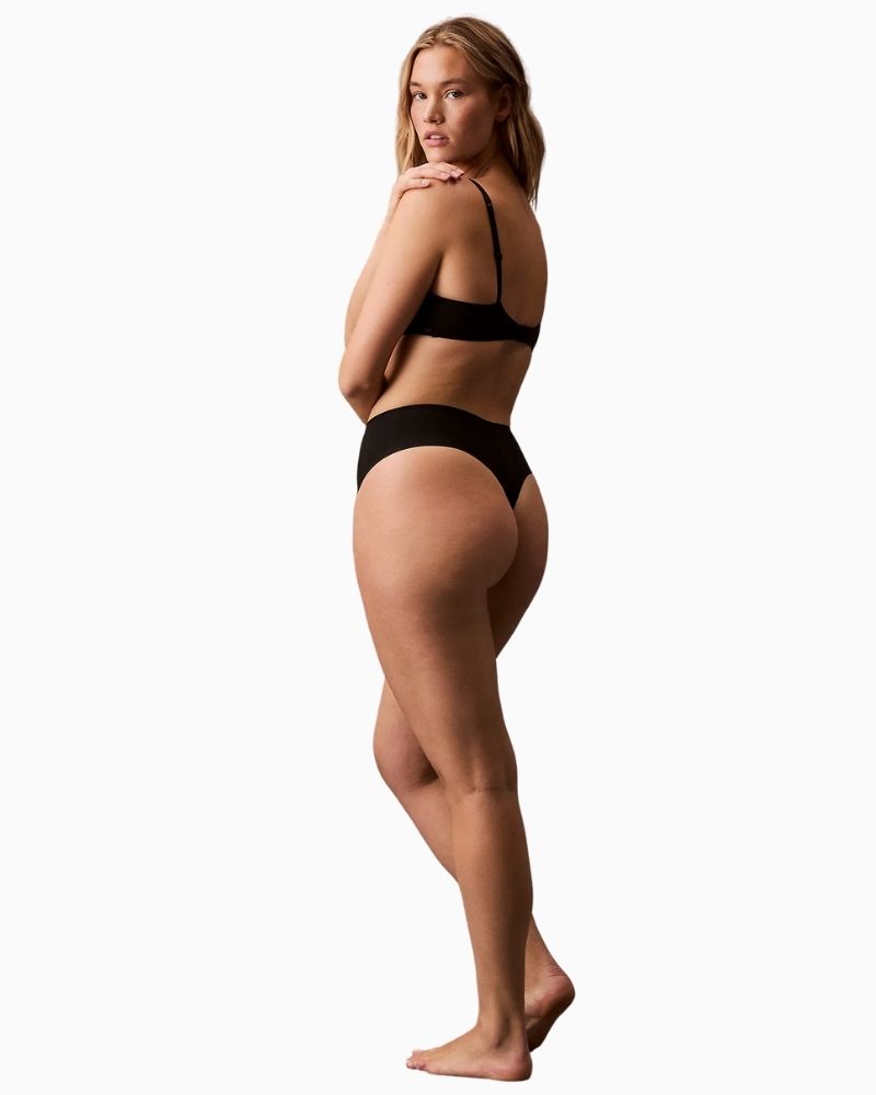 Side view of Calvin Klein Stay Put thong showing smooth, no-show finish