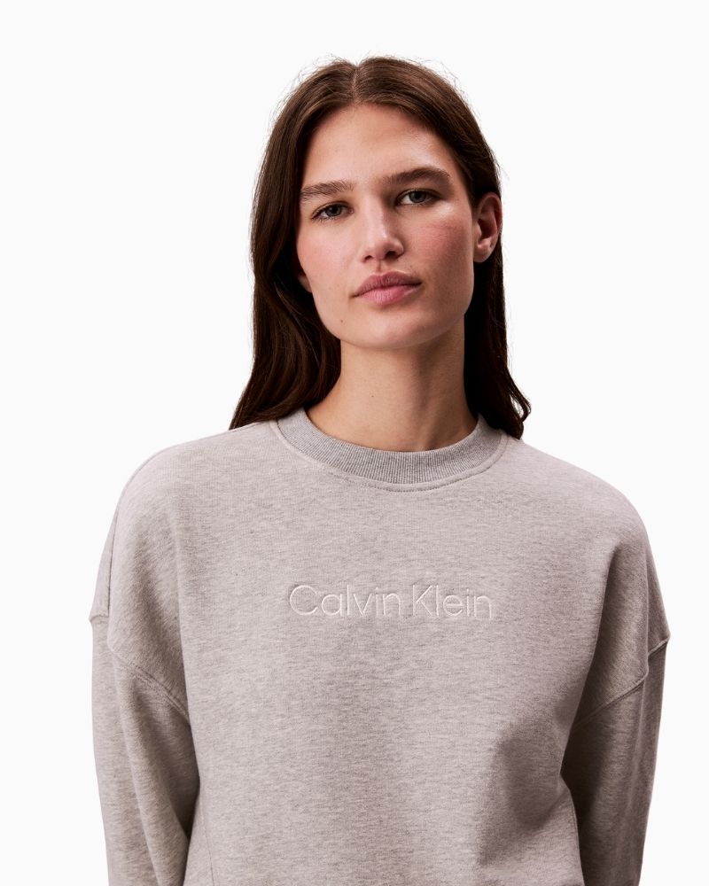 Front view of Calvin Klein grey sweatshirt showing relaxed fit and soft texture
