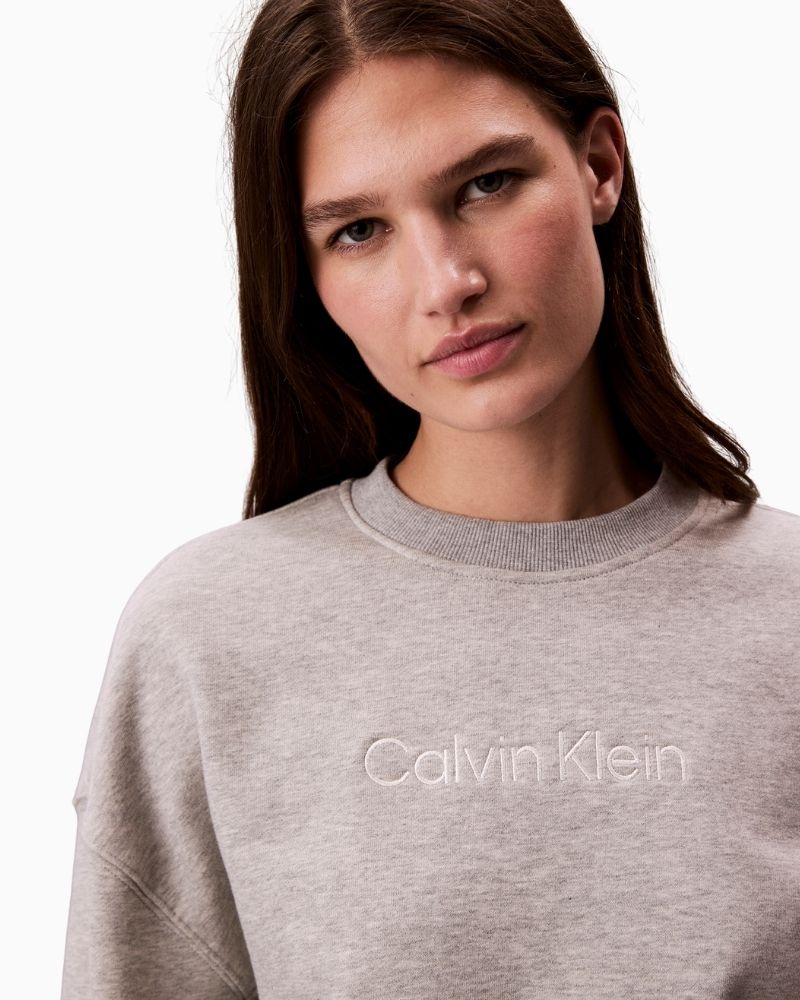 Front view of Calvin Klein grey sweatshirt showing relaxed fit and soft texture