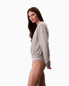 Side view of Calvin Klein grey cotton-blend sweatshirt with crew neck and ribbed cuffs