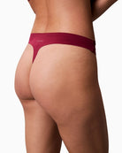 Close up of Flat lay of CK thong in soft pink polypropylene blend with logo detail