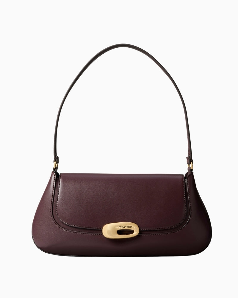 Front view of Calvin Klein top flap shoulder bag with smooth structured design