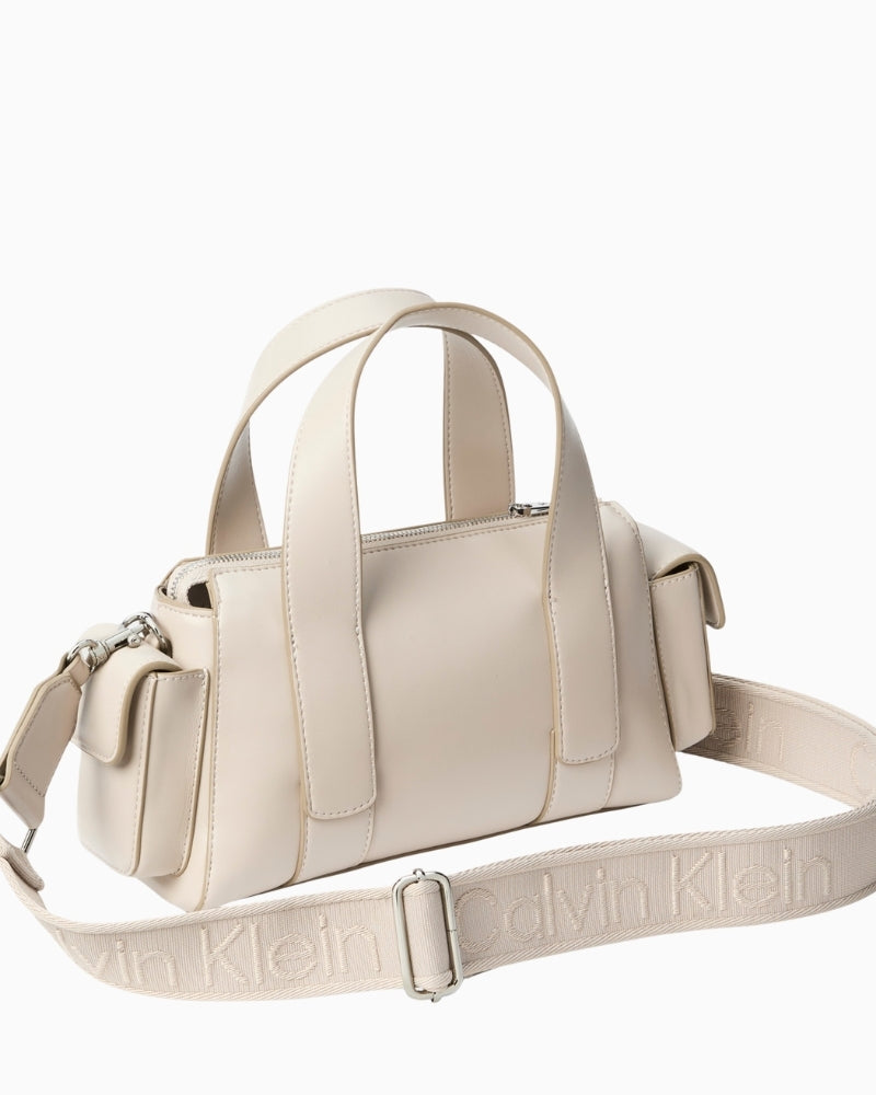 Side profile showing slim leather card holder with embossed texture