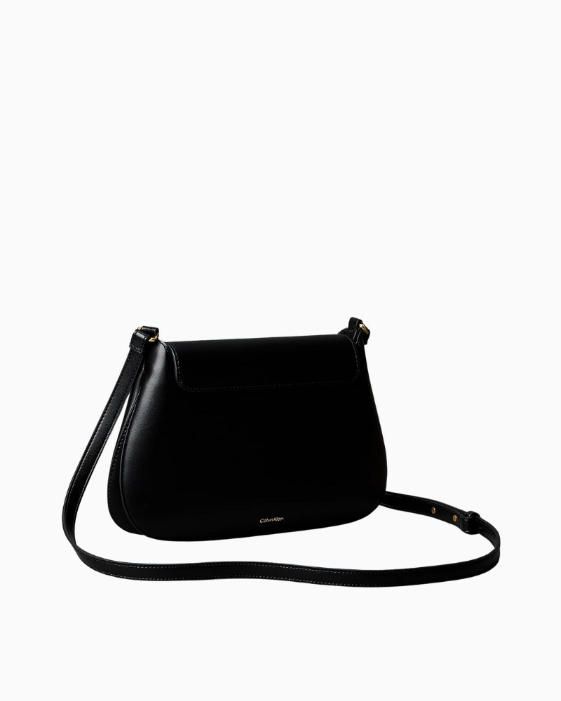Calvin Klein engraved medium flap crossbody bag black back view – Áines Boutique