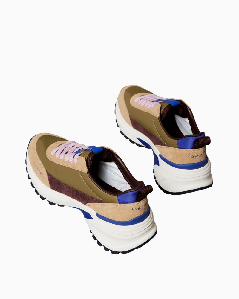 Back view of low-cut leather trainers in khaki and purple blue