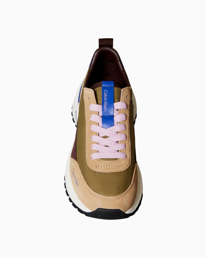 Close-up of Calvin Klein branding on multicolour casual trainers