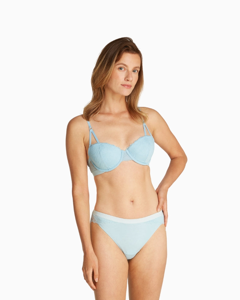 Model styling Calvin Klein lift balconette bra with matching underwear