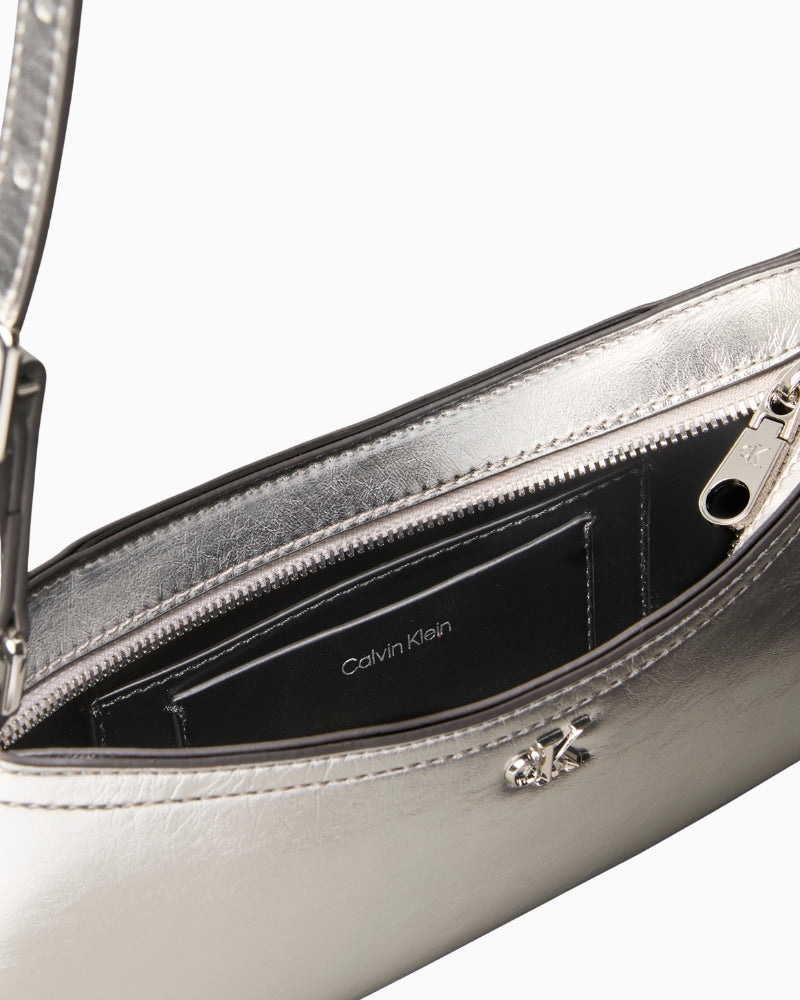 Calvin Klein metallic small shoulder bag in silver, interior view showing lining – Áines Boutique