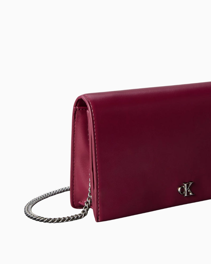 Calvin Klein monogram chain wallet, close-up detail of monogram plaque and texture – Áines Boutique