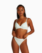 Model wearing Calvin Klein thong in moonlight jade colour