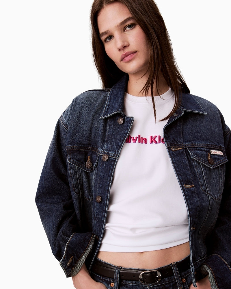 Close-up of CK logo tee showing textured embroidery and crew neckline