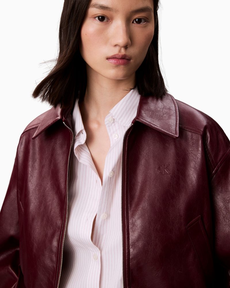 Close-up of faux leather texture and Calvin Klein branding