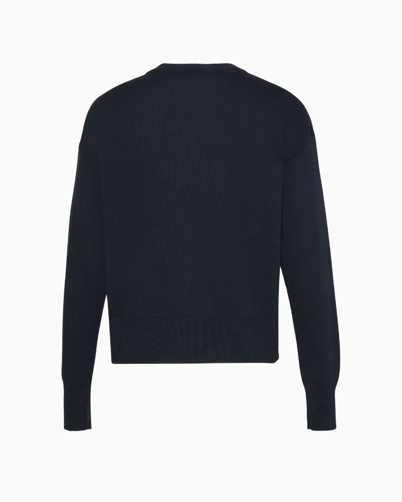 Back of CK graphic top styled with jeans for a relaxed everyday look