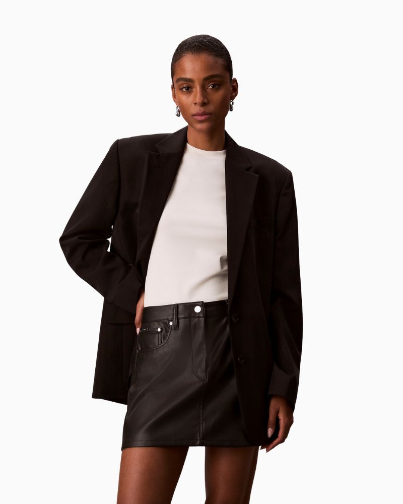 Calvin Klein faux leather black mini skirt with 5-pocket jeans-style design
