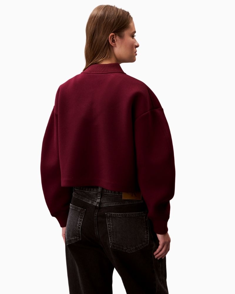 Back view of oversized zip bomber with ribbed collar and cuffs