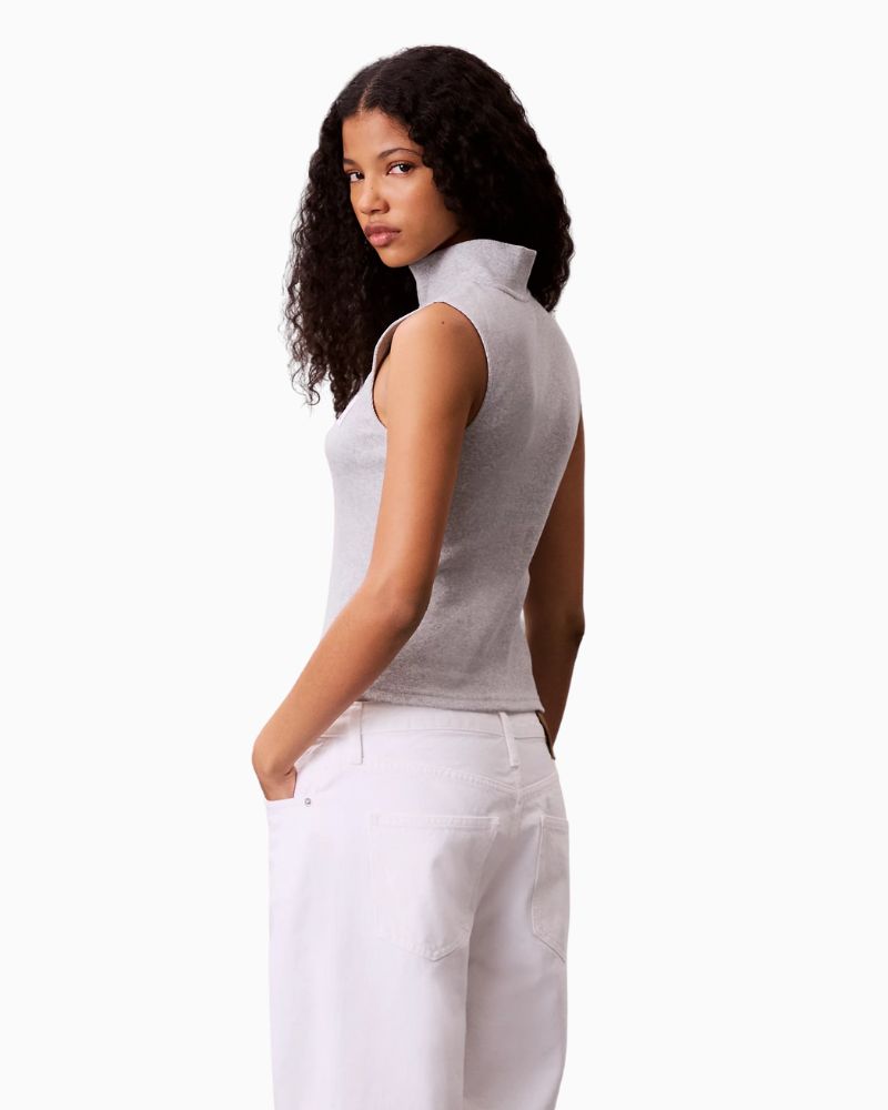 Side view of slim fit top showing clean silhouette and sporty zip detail