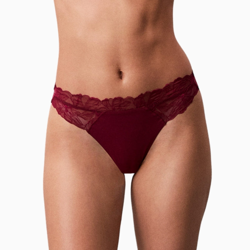 Close up of Calvin Klein pink thong with stretch waistband and smooth finish