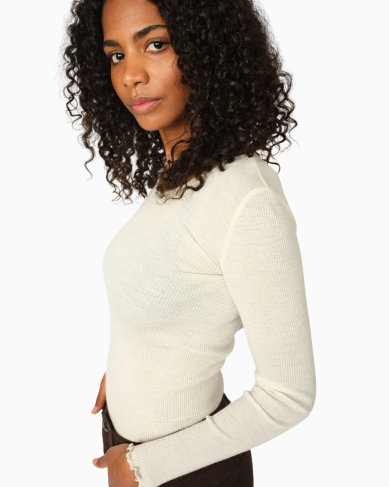 Side view of Mos Mosh Elaine Tee in ribbed wool-modal with ruffle hem