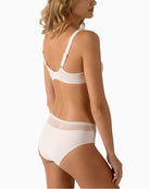 Back view of blush lace full brief showing soft coverage and stretch waist