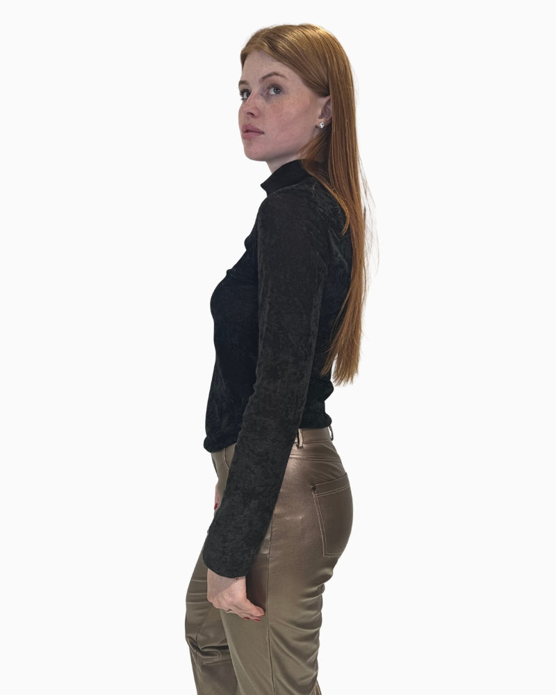 Side view of Eva Kayan black roll neck top with velvet finish