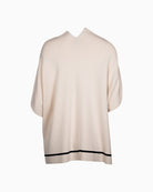 Back view of flowing cape with clean drape and bold edging