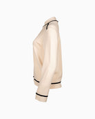 Side angle showing long sleeves and modern neckline on Faber jumper