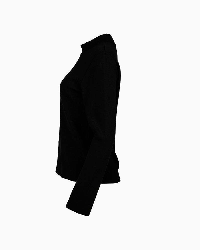 Side view of long sleeve knit top with stand-up collar and subtle shine