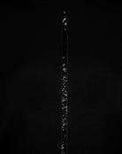 Close-up of sequin ribbon detail on Faber black turtleneck knit