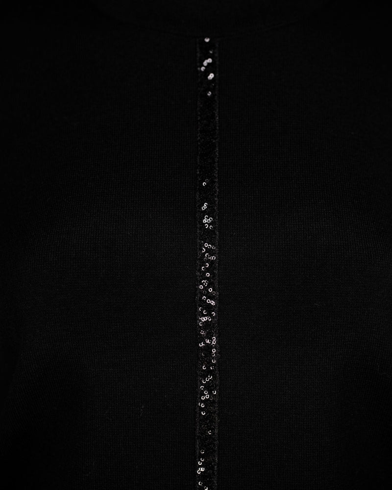 Close-up of sequin ribbon detail on Faber black turtleneck knit