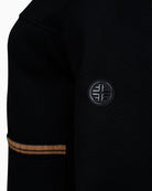 Close-up of two-way zipper and logo sleeve coin on Faber scuba jacket