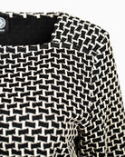 Close-up of woven texture and neckline detail on Faber square neck top