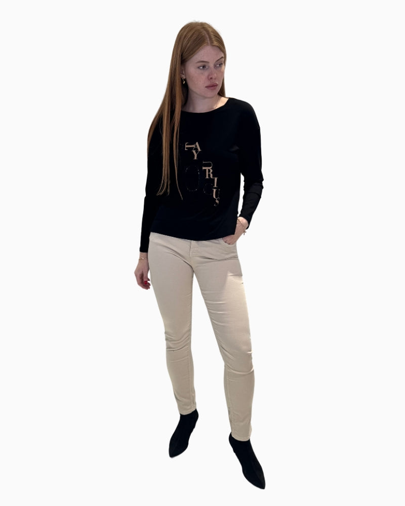 Full-length Faber skinny trousers in cream styled with blouse