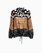 Front view of long sleeve blouse with placed print and drawstring hem