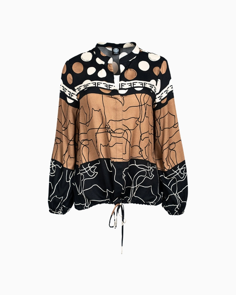 Front view of long sleeve blouse with placed print and drawstring hem