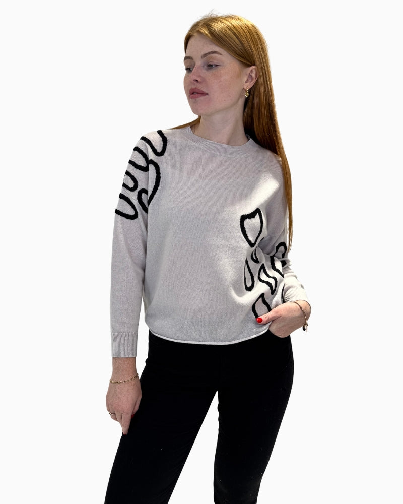 Front view of Faber Woman cream jumper with black abstract print and a relaxed fit