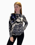 Front view of Faber Woman mixed print jumper with abstract and animal patterns