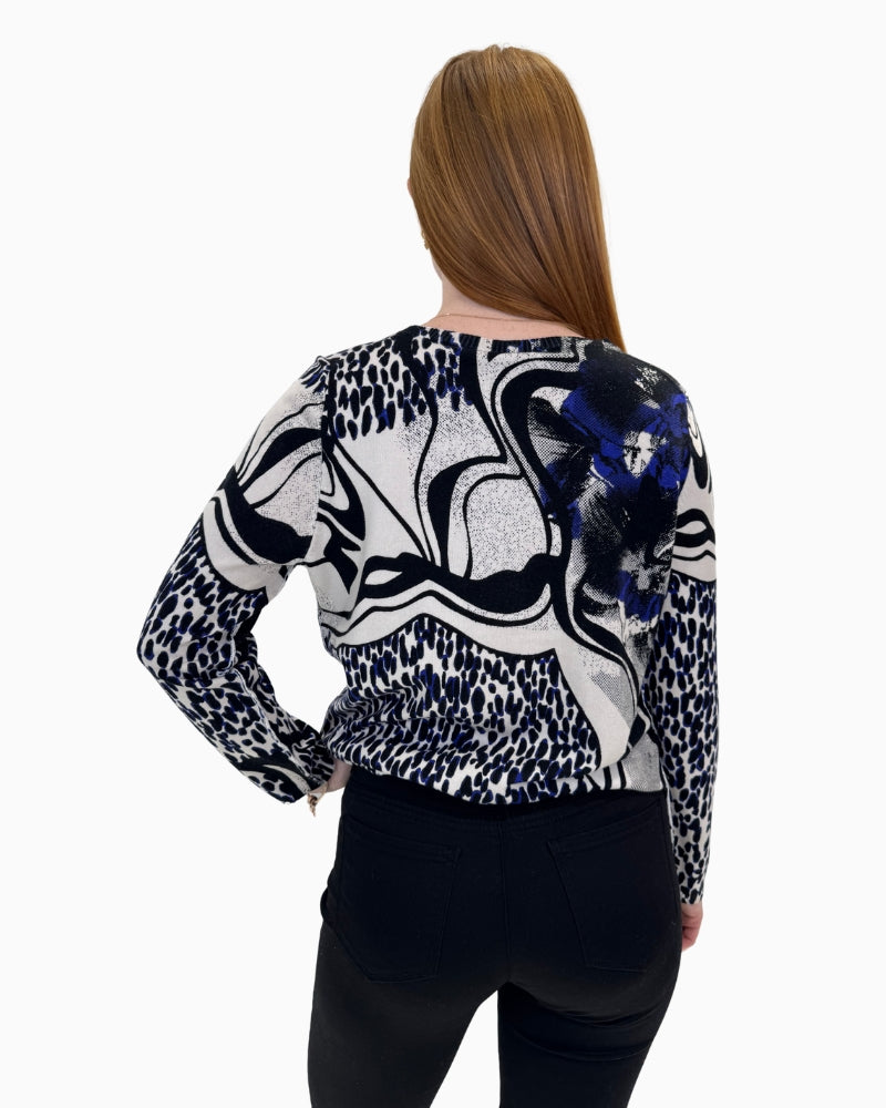 Back view of the mixed print jumper showing the bold pattern and elasticated hem