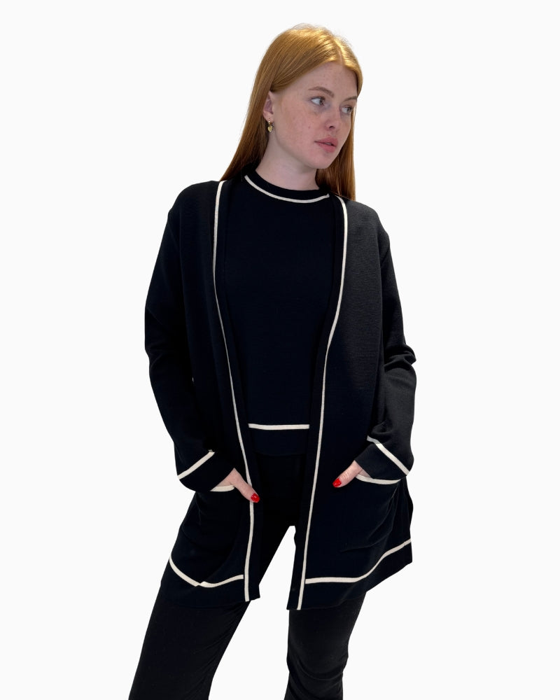Front view of Faber Woman black open cardigan showing white trim and pockets