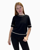 Front view of Faber Woman black short-sleeved jumper showing white trim and relaxed fit