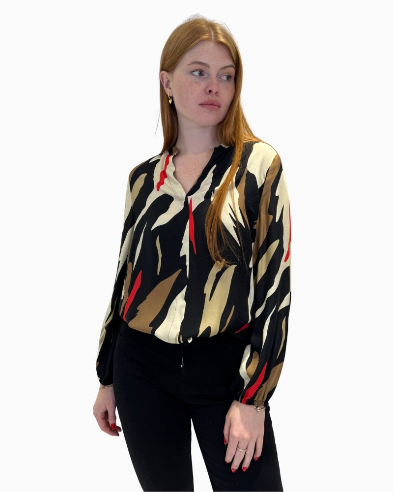 Front view of Faber Woman V-neck blouse showing black and camel abstract print and drawstring hem