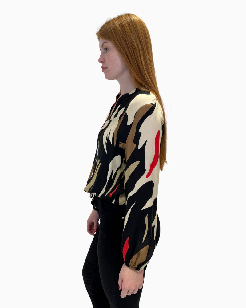 Side profile of the Faber Woman 64401 blouse showing the relaxed fit and ruffled neckline