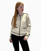 Front view of Faber cream zip cardigan with black trim and ring pull detail