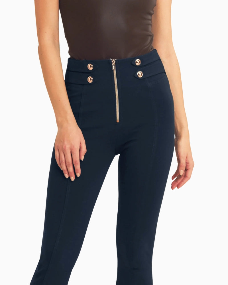 Close-up of waistband and gold button detail on midnight navy trousers