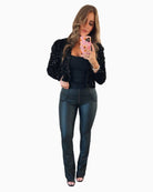Freddy cropped faux leather trousers in black with high waist and flared leg