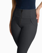 Close up of Freddy cropped faux leather trousers in black with high waist and flared leg