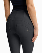 Back Close up of Freddy cropped faux leather trousers in black with high waist and flared leg