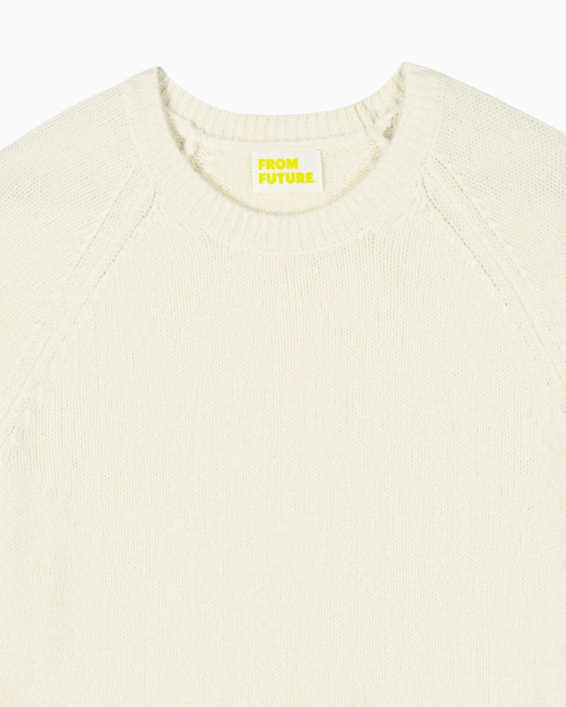 Close-up of fine knit cashmere texture and crew neckline