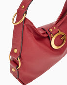 Close-up of gold hardware and Guess script logo on Camden shoulder bag