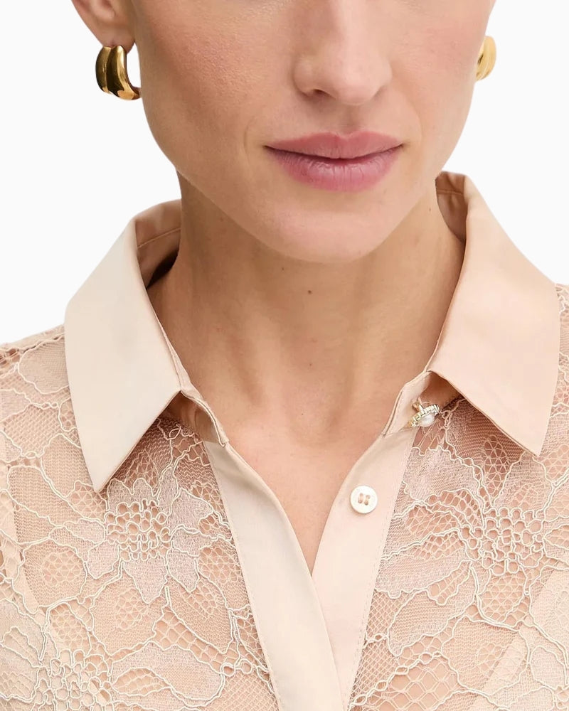 Close-up of sheer lace fabric with snap-button top detail