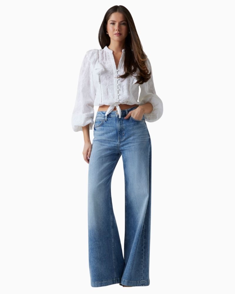 Embroidered v-neck cotton shirt styled with denim for summer days